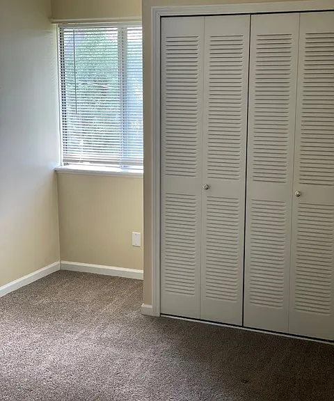 Bedroom with nook for desk by window