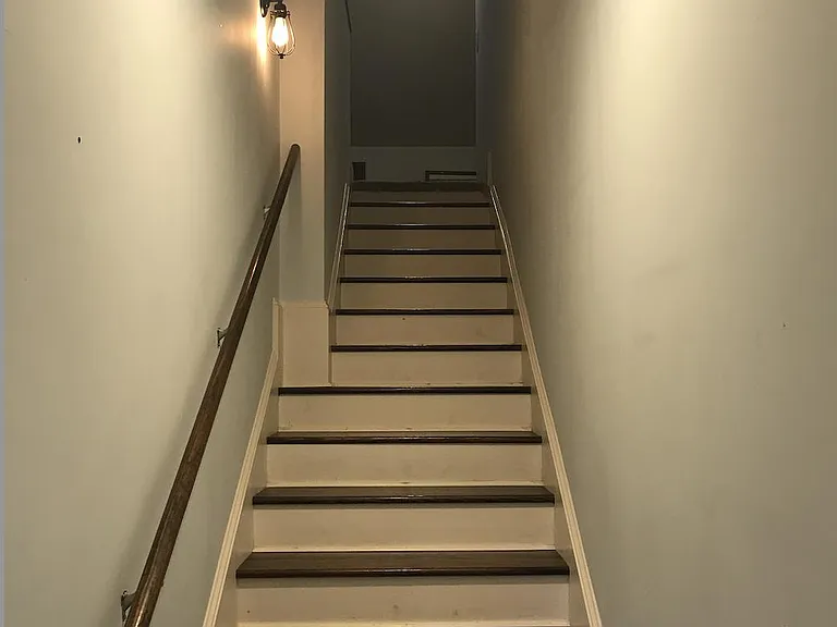 Stairs to upstairs primary bedroom.