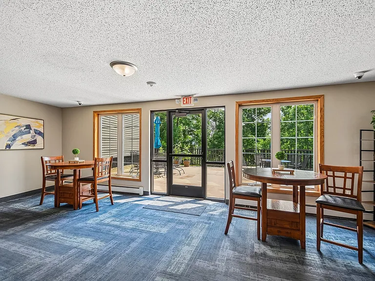 Mill Pond Apartments offers a bright and inviting common area perfect for socializing or relaxing. With large windows inviting natural light, it's an ideal spot for both work and leisure. Schedule a tour to see your new home today!