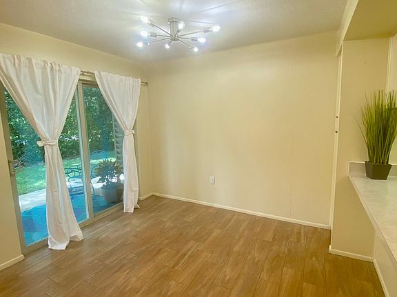 New dining room "Sputnik" lighting fixture captures the essence of the time period when Mai Kai was built. This view also shows outdoor porch and pass--through bar.