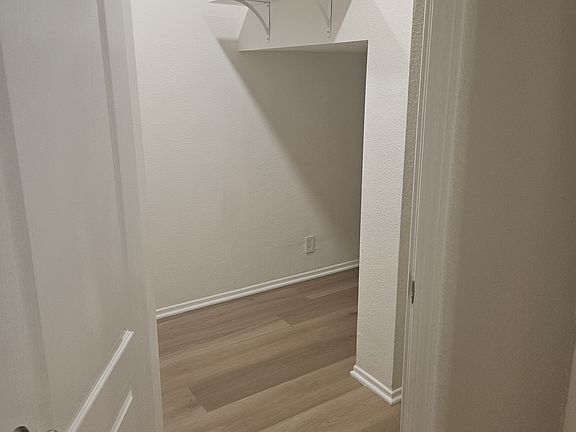 downstairs closet to the left of entrance off the downstairs hallway