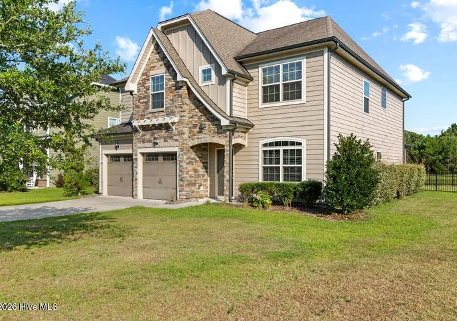 Set along a peaceful pond in the gated community of Mimosa Bay — Photo 2
