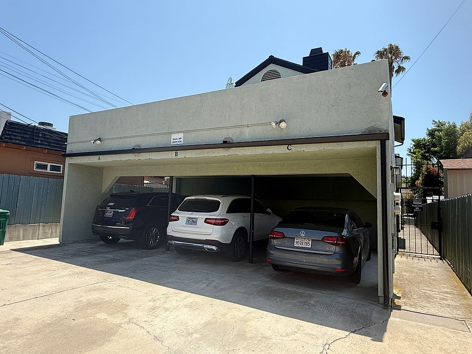 Parking for 2 cars tandem in alley behind complex