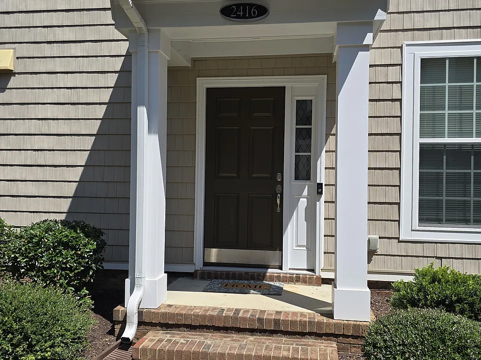 Front Entry @ Rear of Building, serviced by Concrete Walkway from Parking Lot