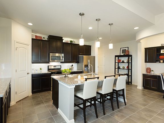 Enjoy family meals in the open-concept kitchen.