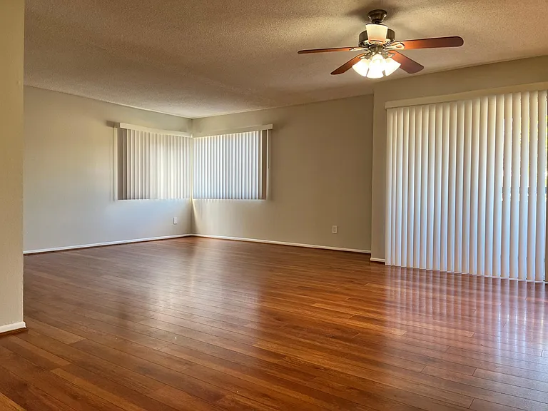 Large open concept living & dining space, with a private balcony