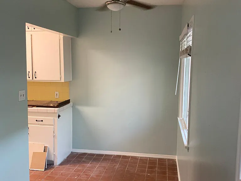 Open dining room off kitchen, at end of living room.