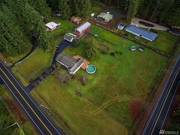 Arial view looking to the northeast - the property is almost square, measuring approx 299' x 319'. The deck is new and there's a large above ground pool for summer fun!