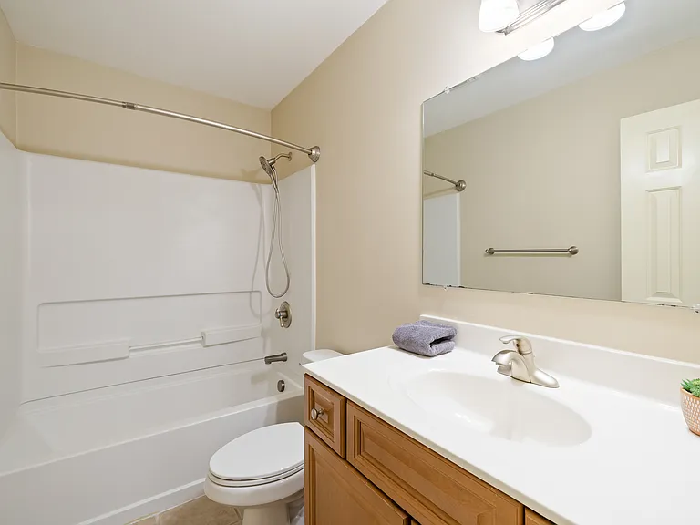 Full bath; located between bedrooms