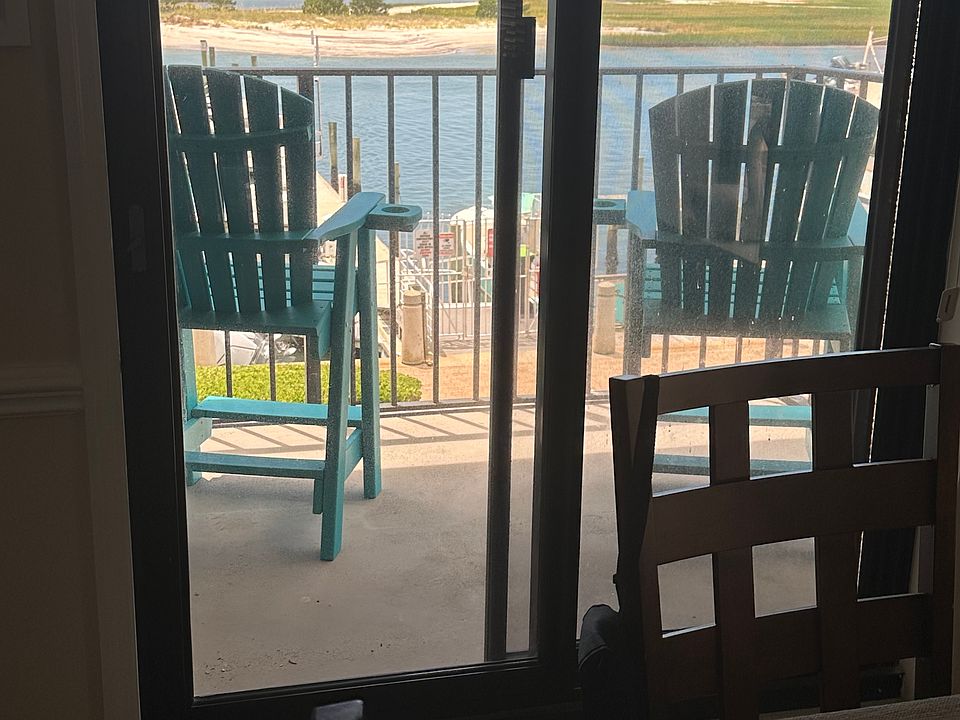 Front deck with 2 polywood chairs, room for 2 more.