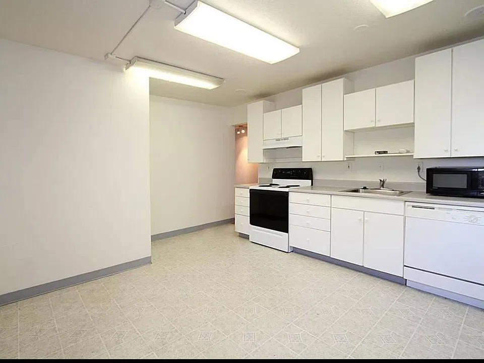 Alternate angle of kitchen with ample storage