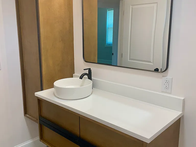 Bathroom with all new flooring, vanity, cabinet, tub, tile, shower, hardware, and toilet. Never been used.