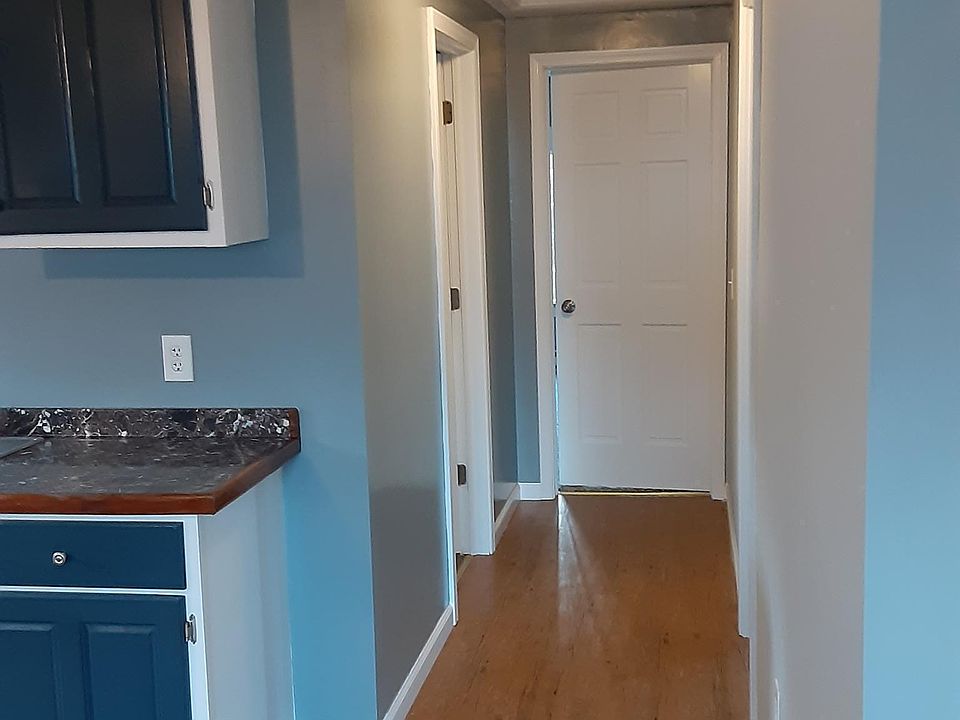 Door in hallway to left goes to bathroom. End of the Hall is the master bedroom. Second bedroom is through door to the right.