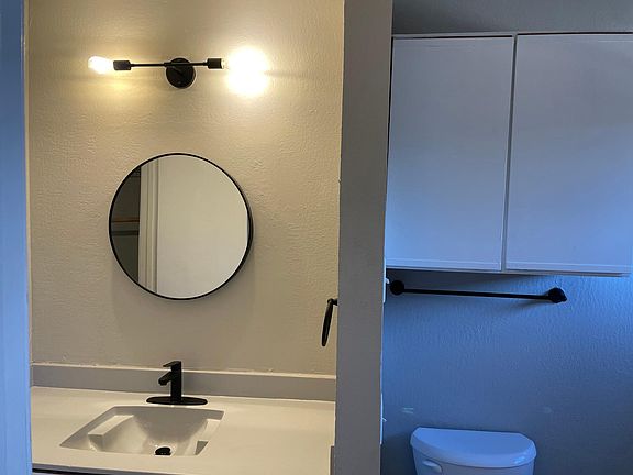 Master bath with tub and closet.