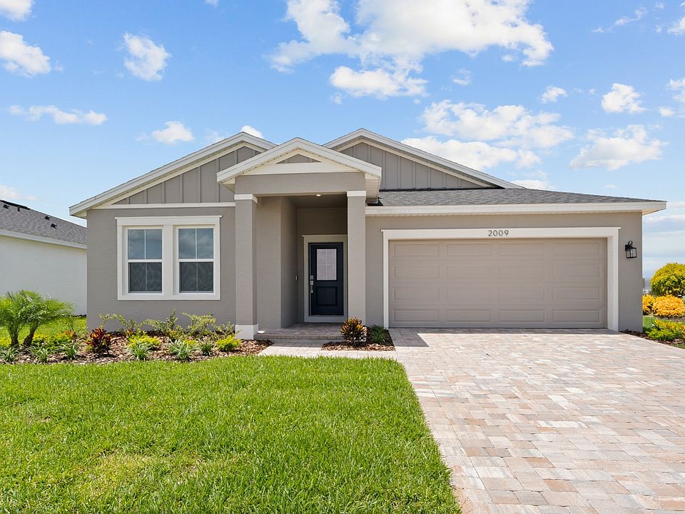 Buttonwood model in coastal elevation with two-car garage and modern curb appeal