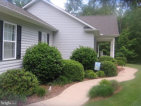 Concrete walk way leading to front porch
