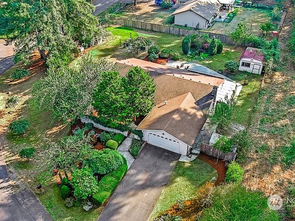 This one-level homes lives large with attached 2 car garage and features a gated front courtyard. >