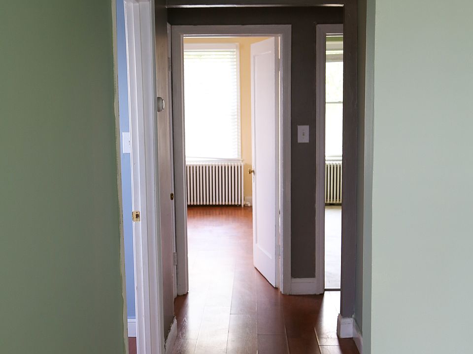 Hallway with Den on left, Bedroom straight ahead, and Kitchen to the right