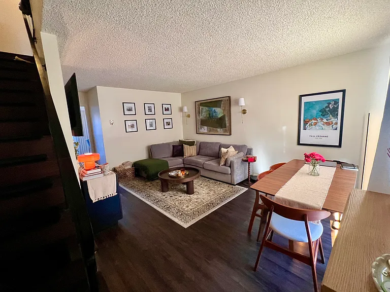 Furnished neighboring unit shown for living room entrance layout reference