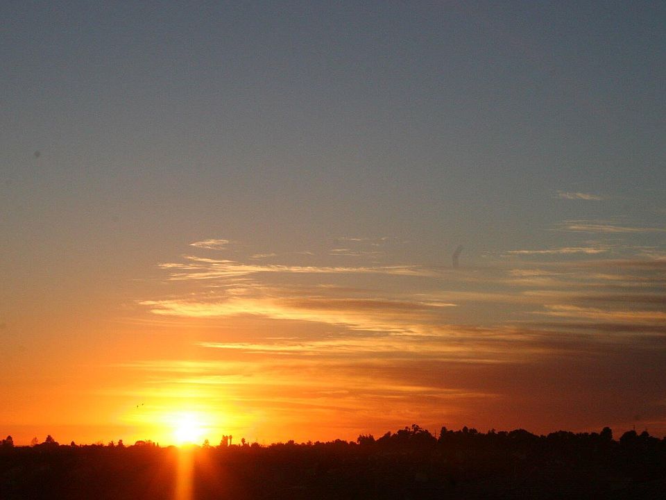 Amazing sunset and mountain views. Sliver view of ocean. And can see downtown SD buildings.