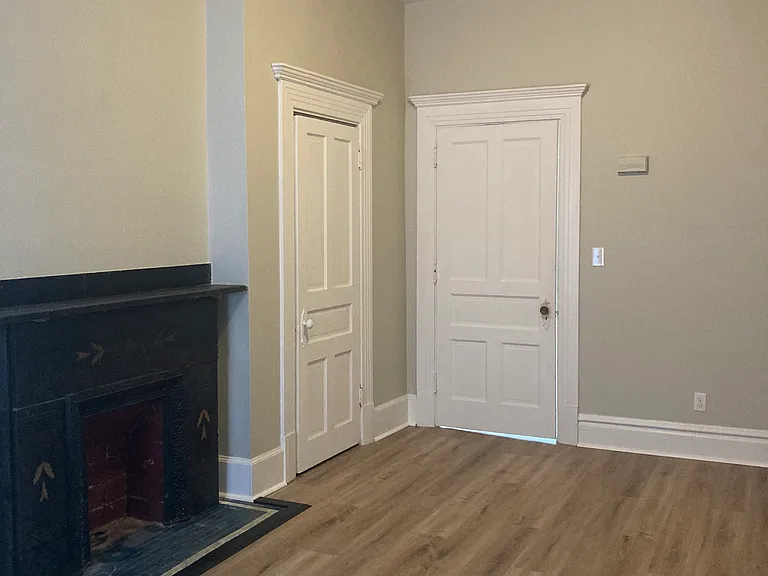 Living room has a closet for extra storage.