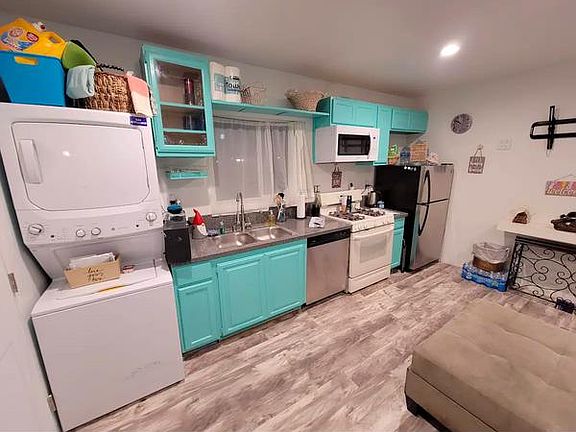 Full Size stackable washer and dryer. Full Kitchen with dishwasher, disposal, stove/oven and microwave.