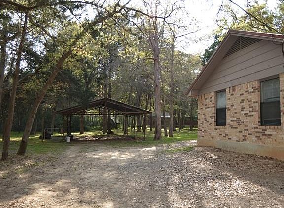 2 Car Carport or work area.....the back door to this home has 2 doors that makes for easy entrance from carport area.