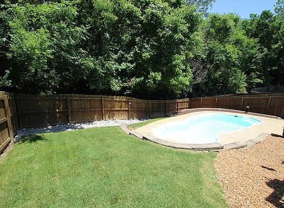 Relax in the in-ground pool with privacy all around!
