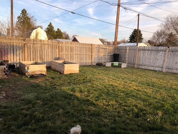 Large yard with raised beds