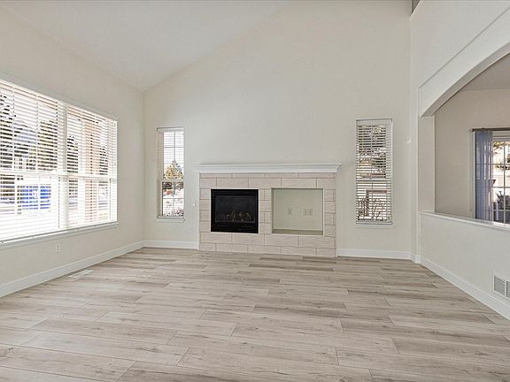 Family room with fireplace and open to the eating space to right