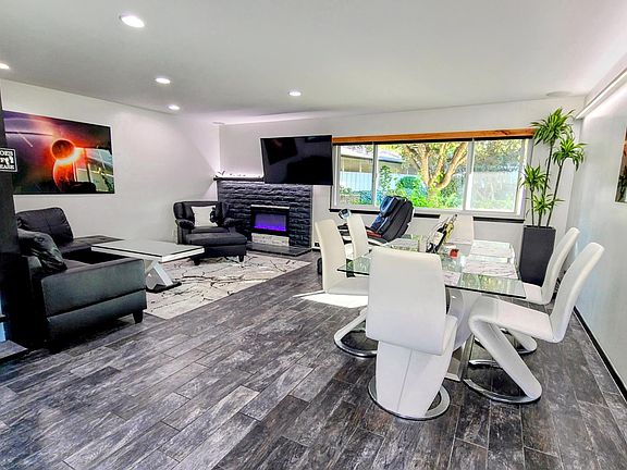 65" 4K HDTV with surround, electric fireplace with customizable color, motorized window shades. Everything seen can be included.