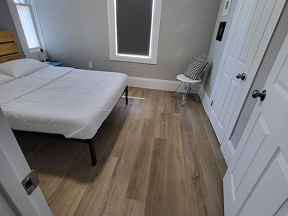 Secondary bedroom has a full size memory foam mattress, bedside lighting, and a large closet.