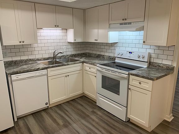 Fully renovated kitchen. New cabinets, countertops, and appliances.