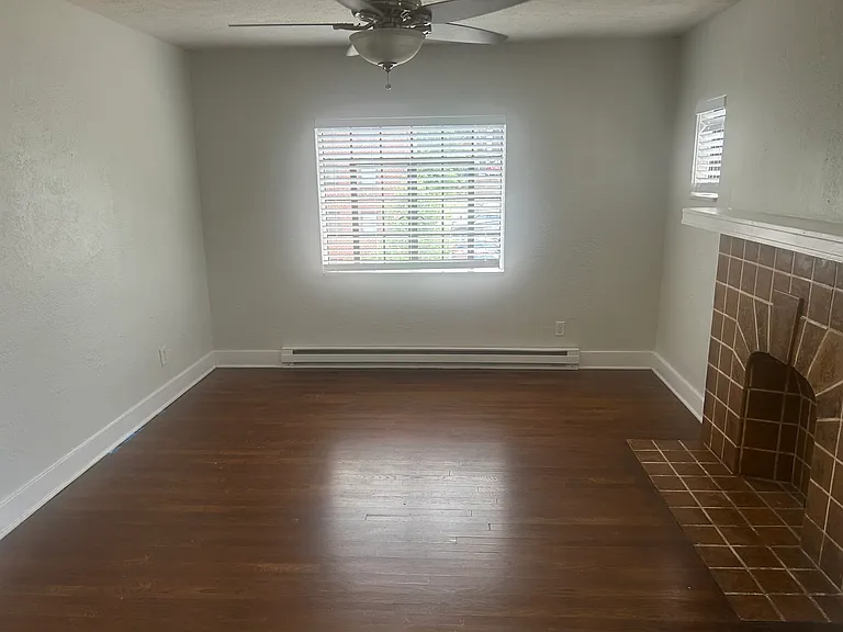 Living Room - Hardwood floors, ceiling fan, decorative mantle