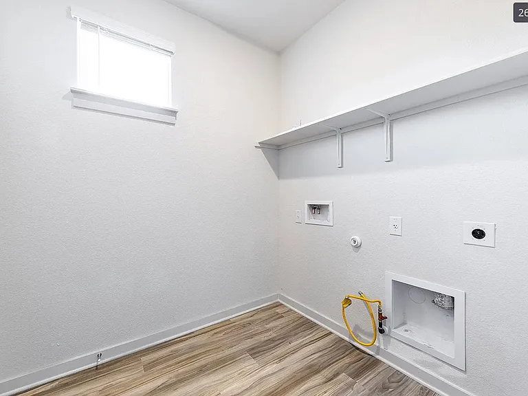 Laundry room with a closet