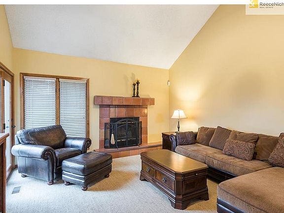 Open family room and wood burning fireplace.