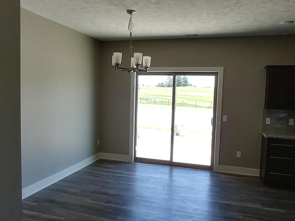 Open concept kitchen, dining room and living room with walk