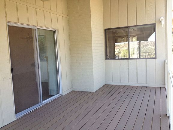 Sliding glass doors open to covered deck
