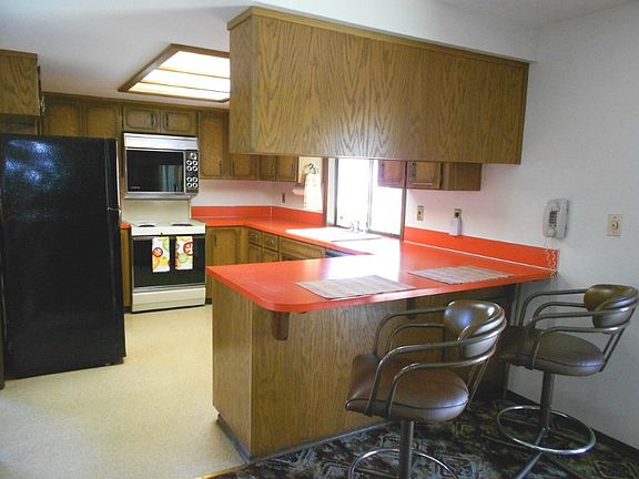 Family room off kitchen with eating area and cozy fireplace.