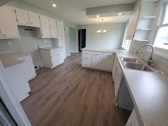 Stainless steel appliances have been installed - stove, refrigerator, dishwasher and microwave.