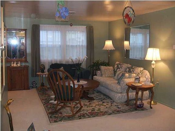 The large living room invites you & guests in for a visit.