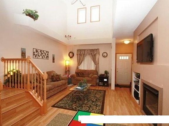 welcoming entryway with fireplace . High ceilings