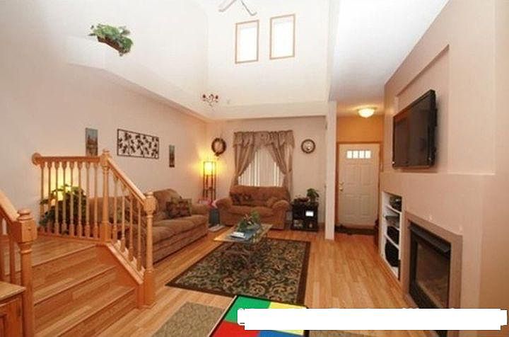 welcoming entryway with fireplace . High ceilings