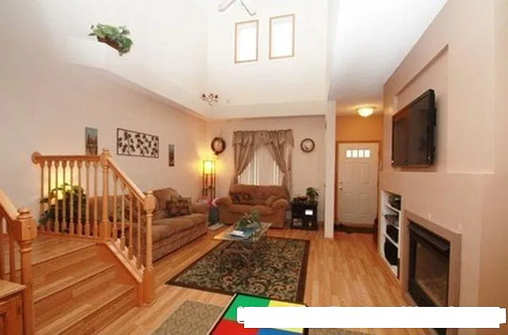 welcoming entryway with fireplace . High ceilings