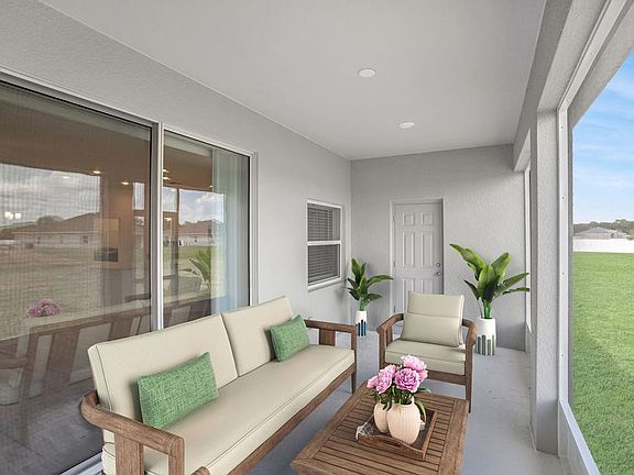 Your interior opens to outdoor living space on a large covered lanai - Willow II by Highland Homes