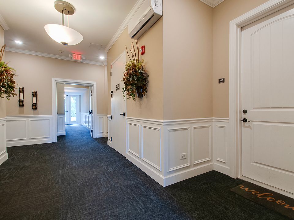 Door to unit 102 from the lobby of the secure-entry building