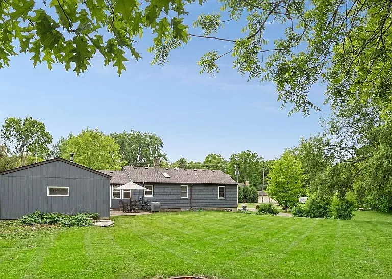 Nice backyard with patio, 2 car garage, and shed.