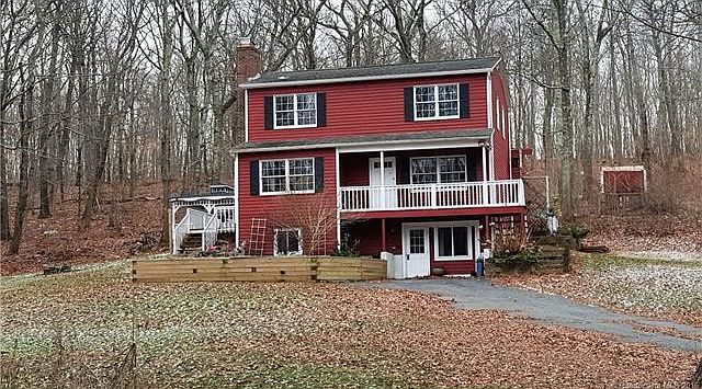 Front view of home with wra...