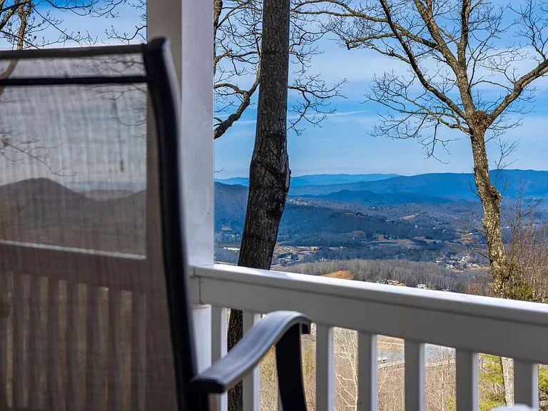 View from upstairs deck, table and chairs for relaxing or dining. BBQ grille on both decks.