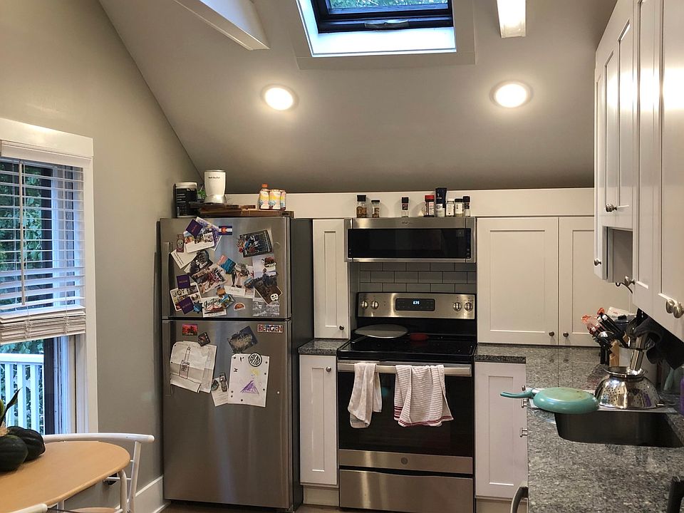 Kitchen with sky light and wood beams